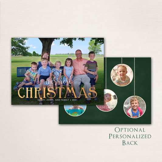 Family sitting outdoors on a bench with “Merriest Christmas” in gold and personalized photo ornaments on the back.