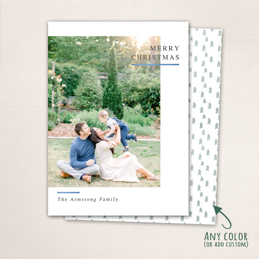 Vertical modern minimalist holiday photo card with “Merry Christmas” text, full-family photo, white border, and optional red snowflake-patterned back customizable in any color.