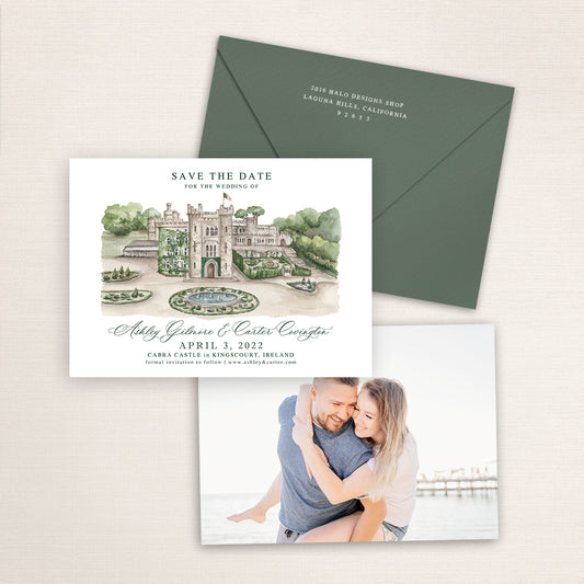 Custom watercolor Save the Date card featuring hand-painted venue illustration of Cabra Castle in Kingscourt, Ireland. Personalized wedding stationery with elegant venue artwork, a photo of the couple on the back, and matching green envelopes with return addresses printed on the back flap.