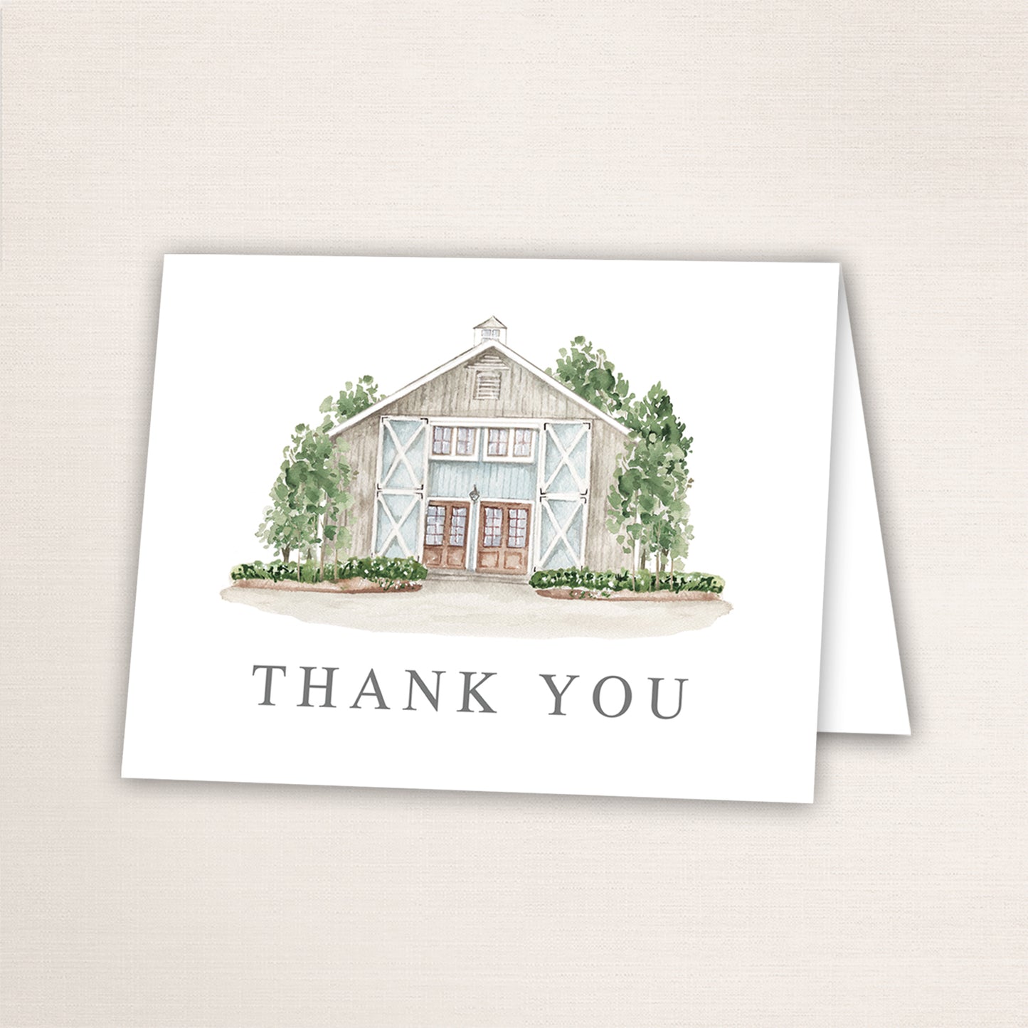 Folded thank you card featuring a hand-painted venue watercolor and “Thank You” text on the front.