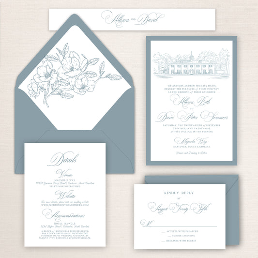 Magnolia Way wedding invitation suite with soft blue envelopes, floral envelope liner, venue illustration, RSVP card, and details insert, designed in a classic calligraphy style.