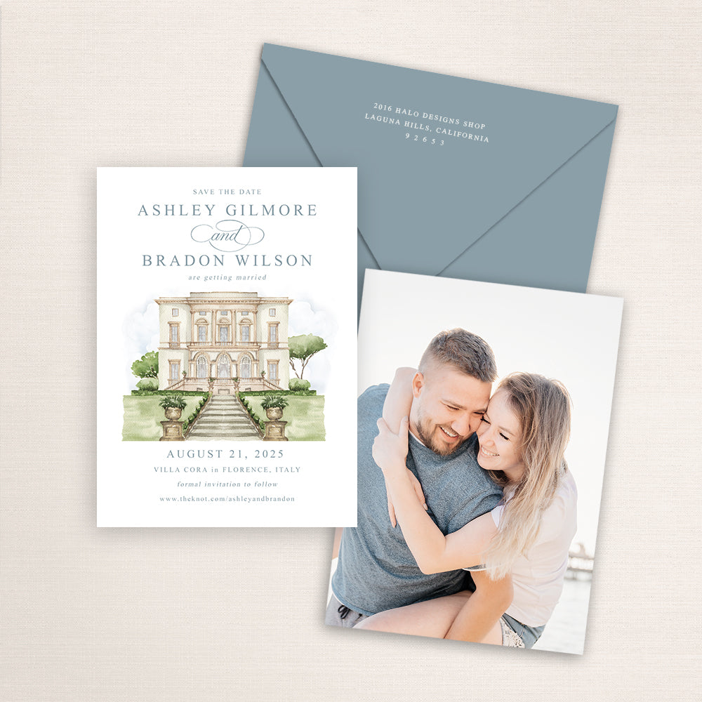 Villa Cora wedding save the date with detailed watercolor venue illustration in Florence, Italy, refined calligraphy text, coordinating blue envelope, and engagement photo printed on the back.