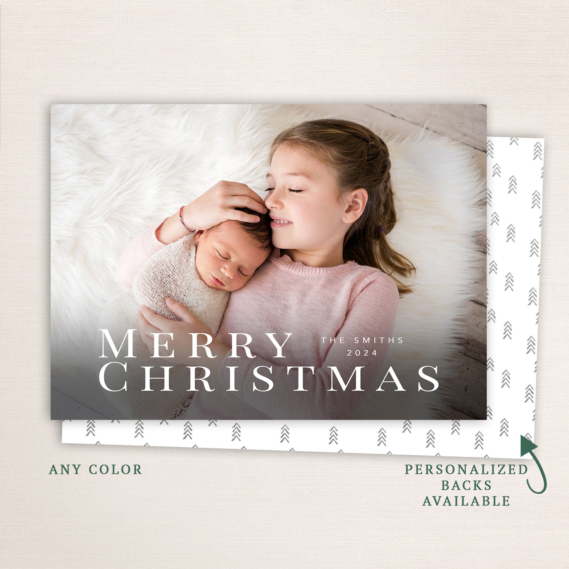 “Merry Christmas” modern holiday photo card from Halo Design Shop featuring a horizontal full-photo layout with elegant serif typography, personalized family name, and customizable back design.