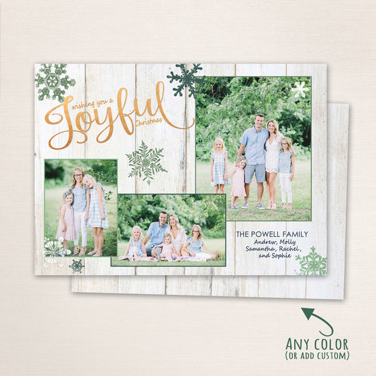 Family standing and sitting outdoors in a lush green field with “Wishing You a Joyful Christmas” text over a rustic wood background and snowflake accents in green tones.