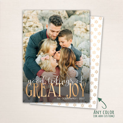 Religious Christmas photo card with “Good Tidings of GREAT JOY” in gold lettering over a full-family photo, featuring a dark patterned back with customizable color options.