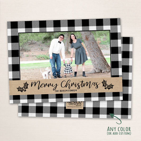 Rustic buffalo plaid Christmas photo card with black and white checkered border, handwritten Merry Christmas text, and kraft-style accent strip.