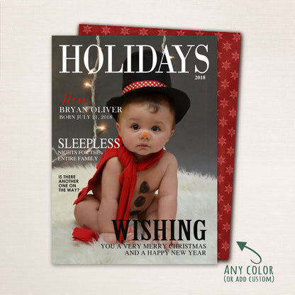 Holiday magazine cover card with baby in snowman outfit and red scarf, featuring playful text and customizable details.