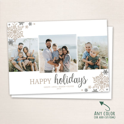 Horizontal holiday photo card displaying three family portraits with “Happy Holidays” in modern script and snowflake embellishments in soft silver and champagne tones, with a note indicating color customization available.