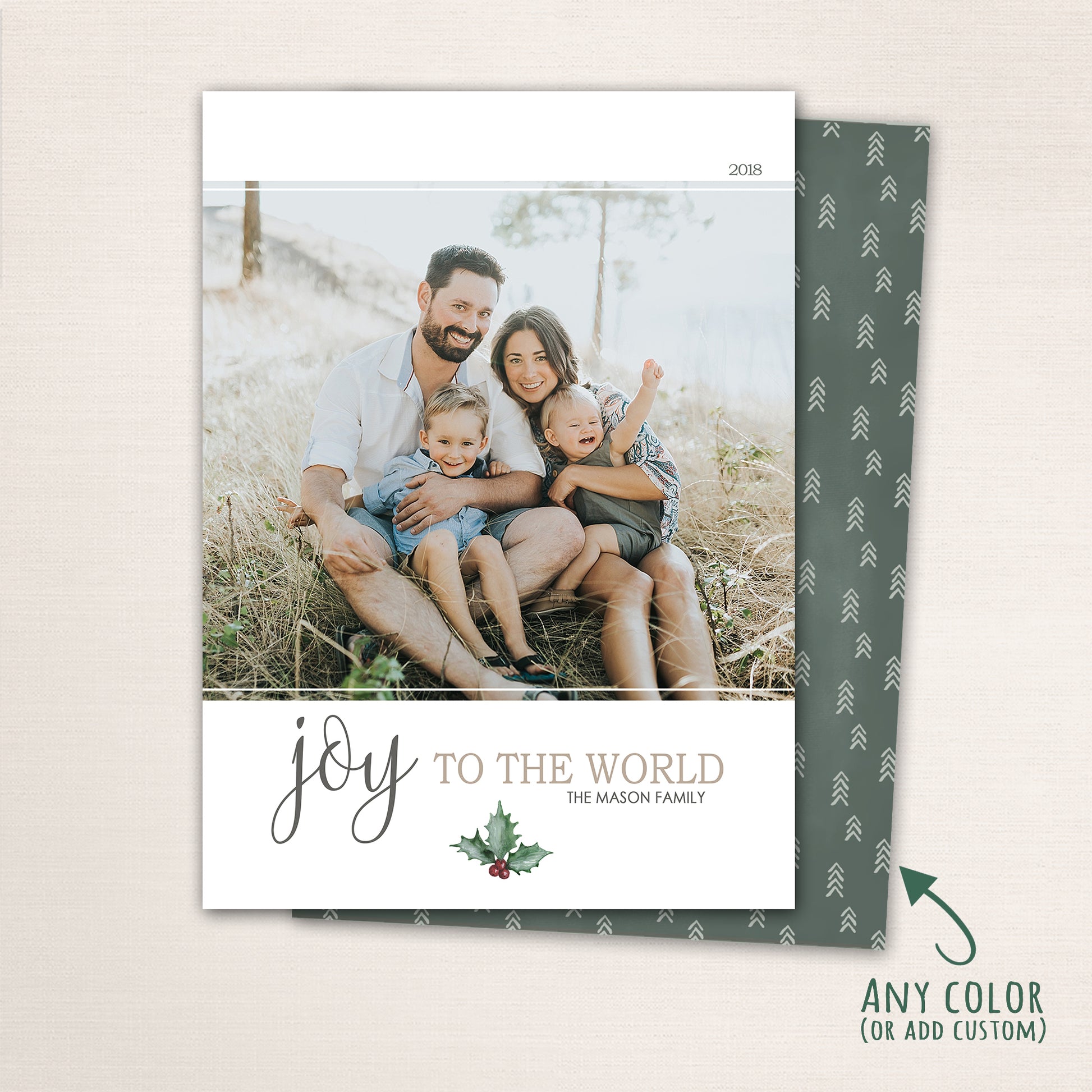 Minimalist Joy to the World Christmas card with family photo, elegant script text, and holly accent.