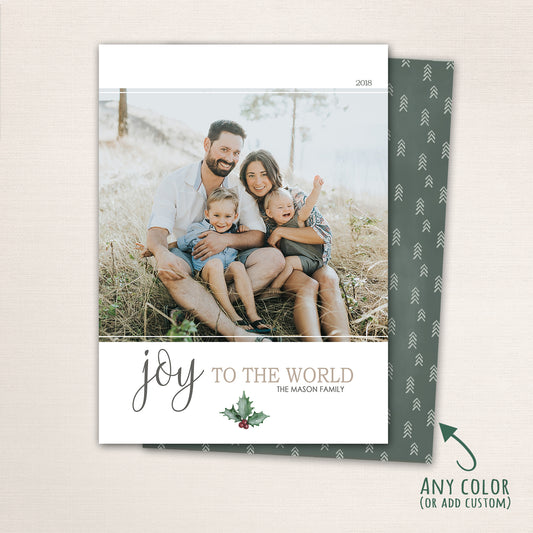 Minimalist Joy to the World Christmas card with family photo, elegant script text, and holly accent.