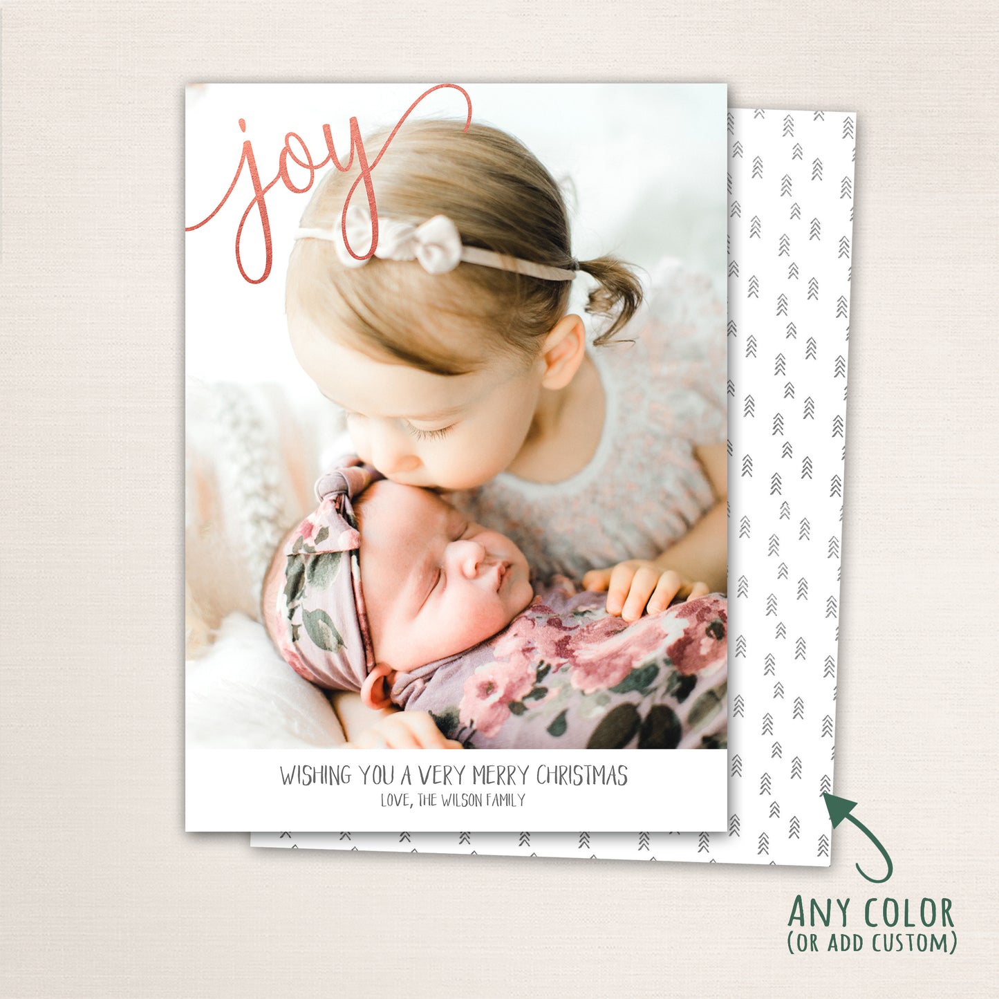 Minimalist Joy Christmas card featuring a full-photo design with elegant script typography and personalized family greeting.