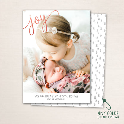 Minimalist Joy Christmas card featuring a full-photo design with elegant script typography and personalized family greeting.