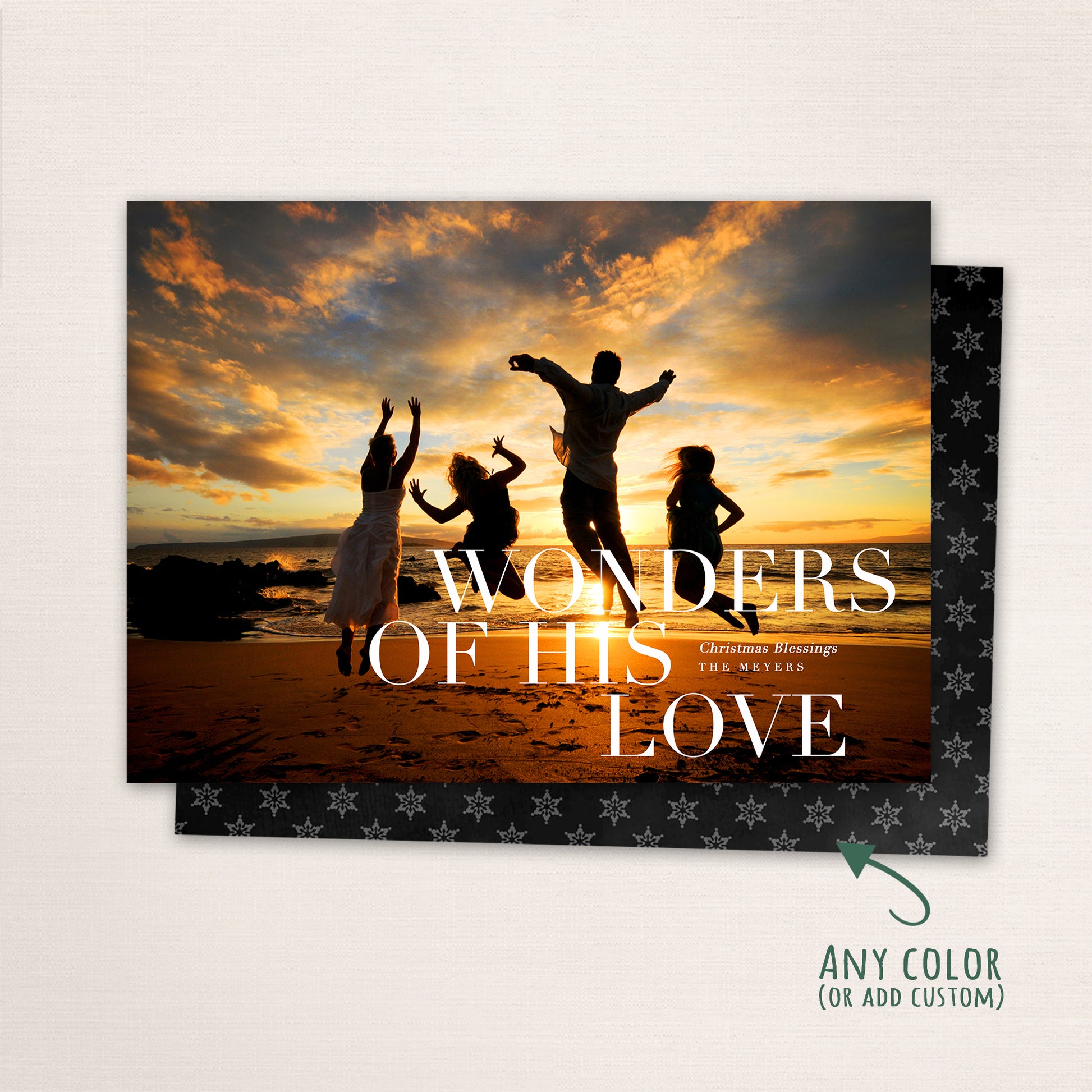 Horizontal Christmas photo card featuring a family sitting outdoors with large white text reading “wonders of His love” customizable with family name and holiday message.
