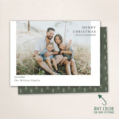 Horizontal modern minimalist holiday photo card with “Merry Christmas” text, full-family photo, white border, and optional red snowflake-patterned back customizable in any color.