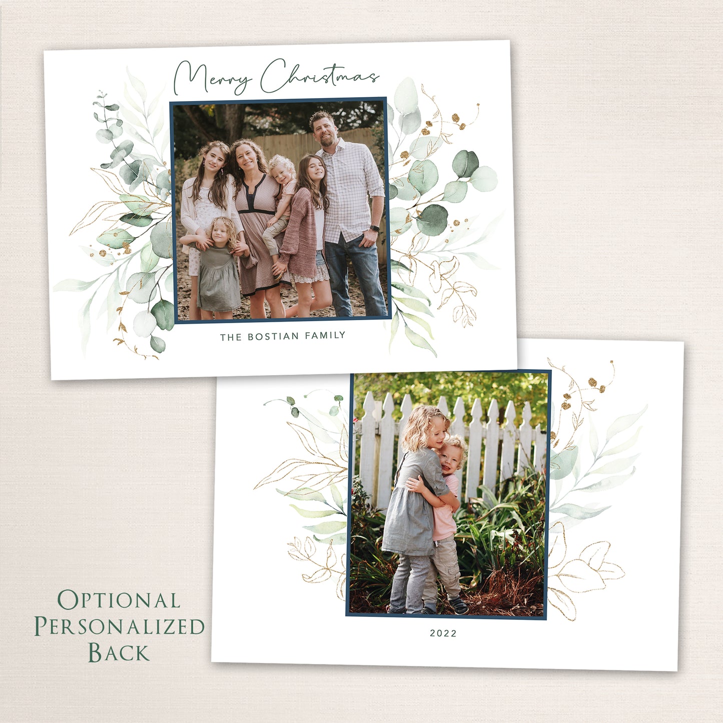 Elegant Merry Christmas photo card featuring a family portrait surrounded by hand-painted watercolor eucalyptus and gold accents. The optional personalized back showcases a second photo framed by matching greenery and soft botanical illustrations.