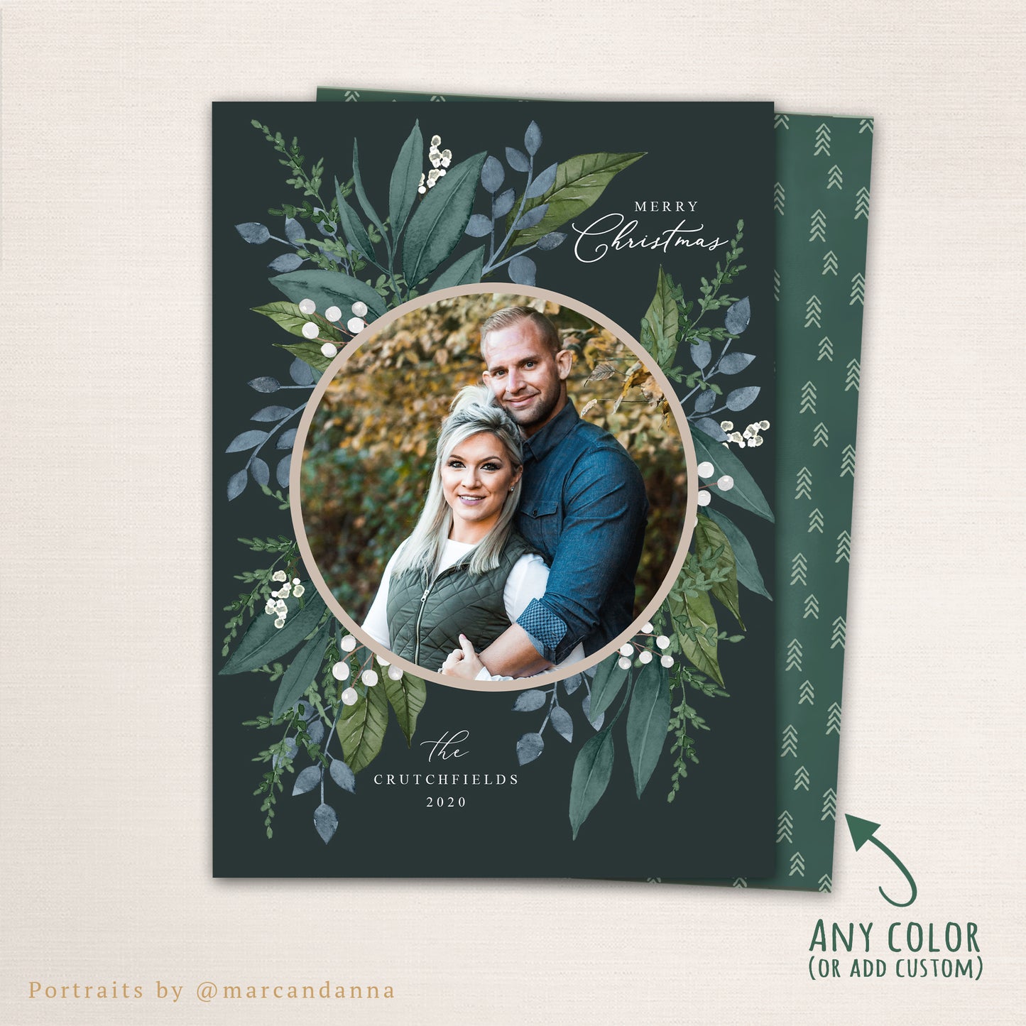 Holiday wreath photo Christmas card featuring a circular photo framed by watercolor greenery and berries, personalized family name, and optional matching back layout for extra photos or text.