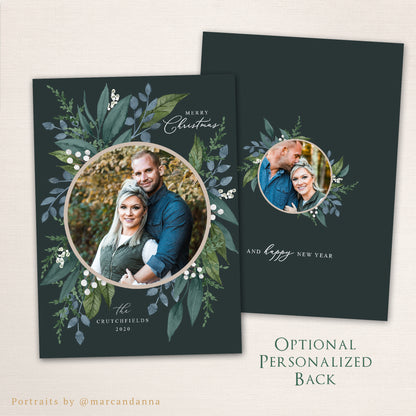 Holiday wreath photo Christmas card featuring a circular photo framed by watercolor greenery and berries, personalized family name, and optional matching back featuring an additional round photo.