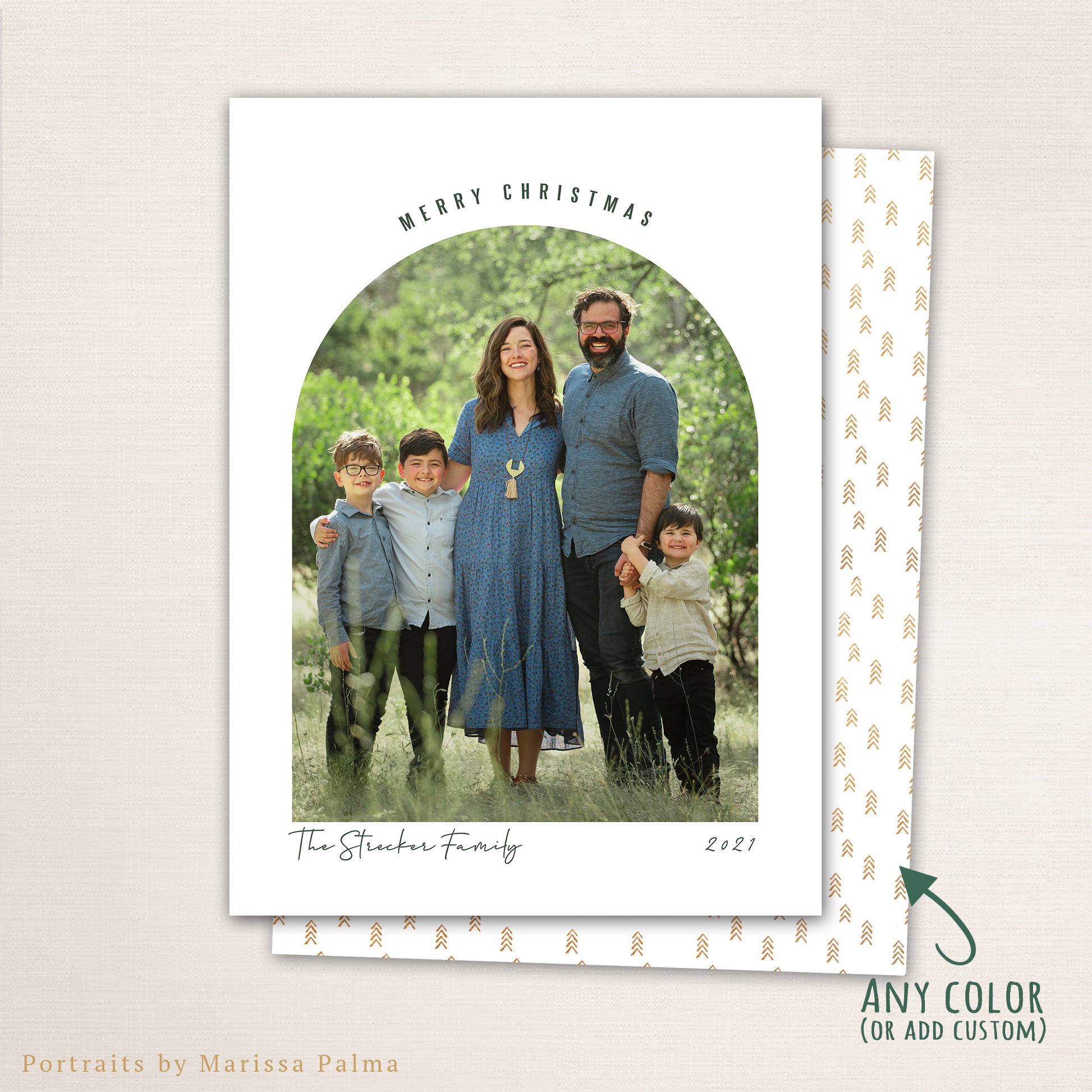 Modern arched Merry Christmas photo card from Halo Design Shop featuring a full-family photo framed in a clean arch layout with minimalist typography, personalized family name, and customizable color back design.