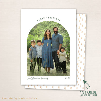 Modern arched Merry Christmas photo card from Halo Design Shop featuring a full-family photo framed in a clean arch layout with minimalist typography, personalized family name, and customizable color back design.
