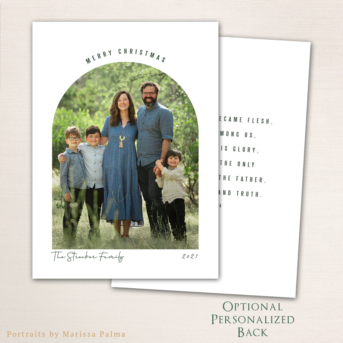 Modern arched Merry Christmas photo card from Halo Design Shop featuring a full-family photo framed in a clean arch layout with minimalist typography, personalized family name, with an optional personal message added to the back