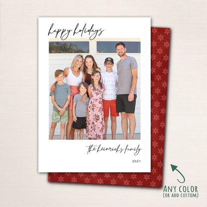Modern Happy Holidays photo card from Halo Design Shop featuring a full-family photo on the front with minimalist black script typography and a snowflake pattern on the back.