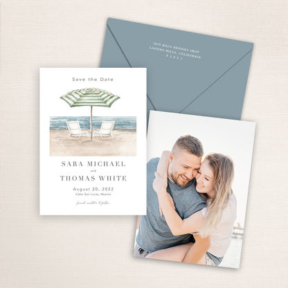 Custom watercolor Save the Date card featuring hand-painted venue illustration of beach chairs and parasol in Manursing Island, New York personalized wedding stationery with elegant venue artwork with matching envelope. 
