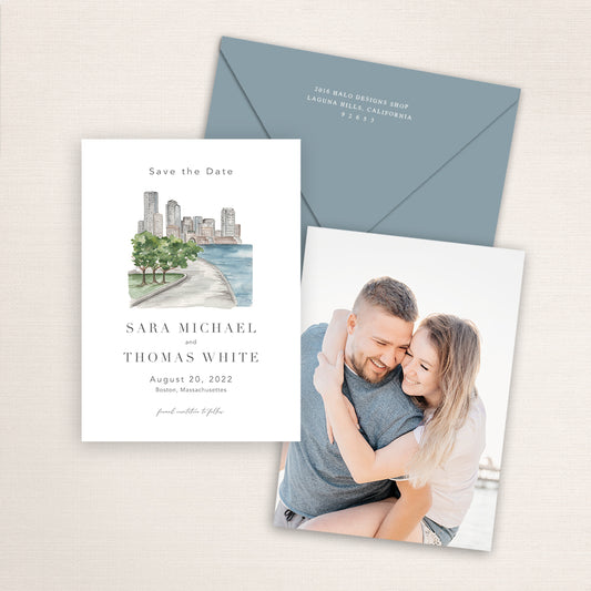 Custom watercolor Save the Date card featuring hand-painted venue illustration of Boston Harbor in Boston, Massachusetts personalized wedding stationery with elegant venue artwork with matching envelope. 