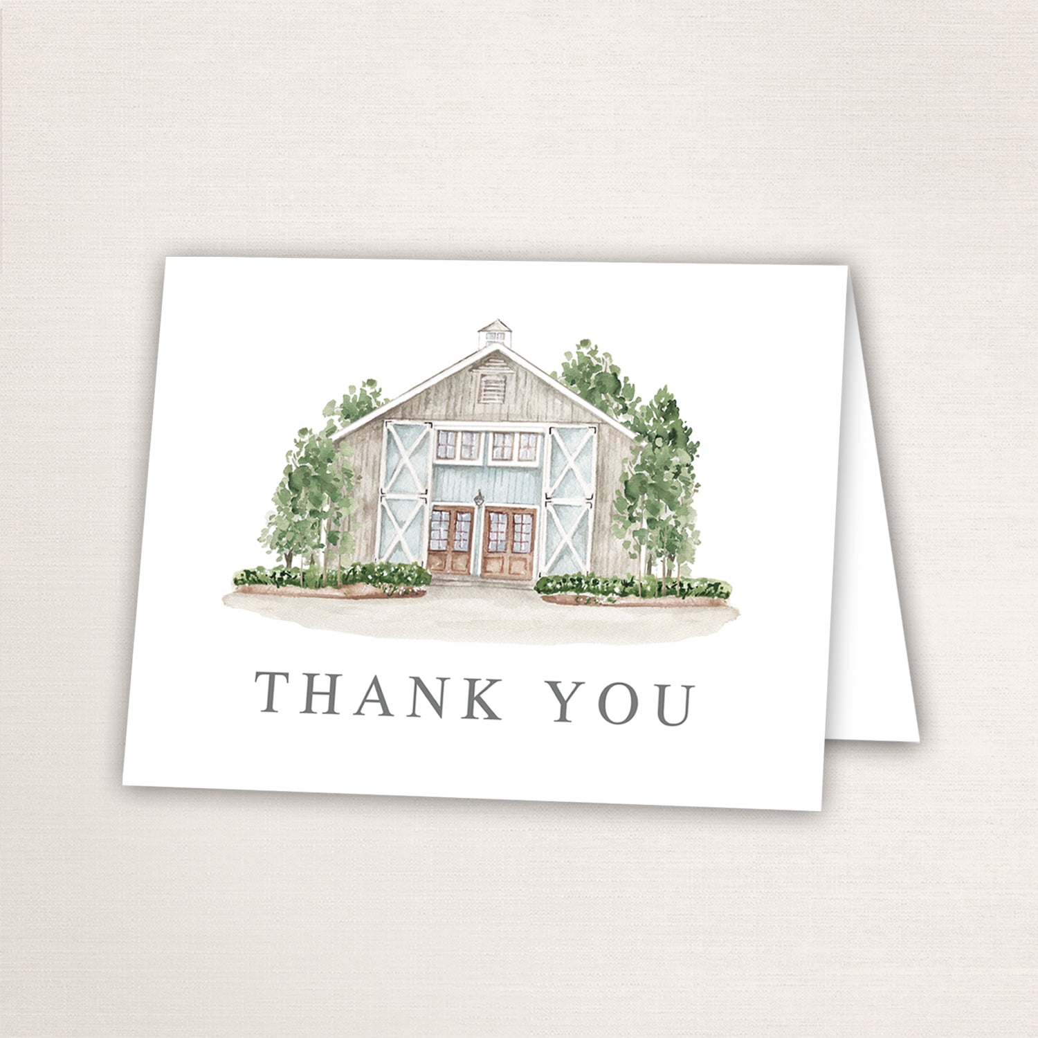 Folded thank you card featuring a hand-painted venue watercolor and “Thank You” text on the front.