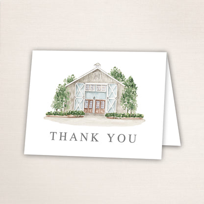 Folded thank you card featuring a hand-painted venue watercolor and “Thank You” text on the front.