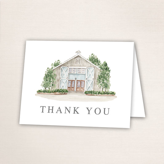 Folded thank you card featuring a hand-painted venue watercolor and “Thank You” text on the front.