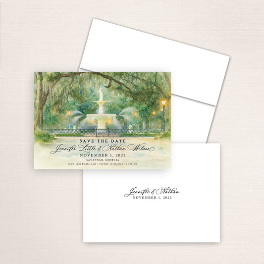 Forsyth Park Fountain save the date with hand-painted watercolor artwork of the Savannah fountain and oak canopy, refined wedding typography layout, coordinating envelope, and minimalist printed back with couple’s names and date.