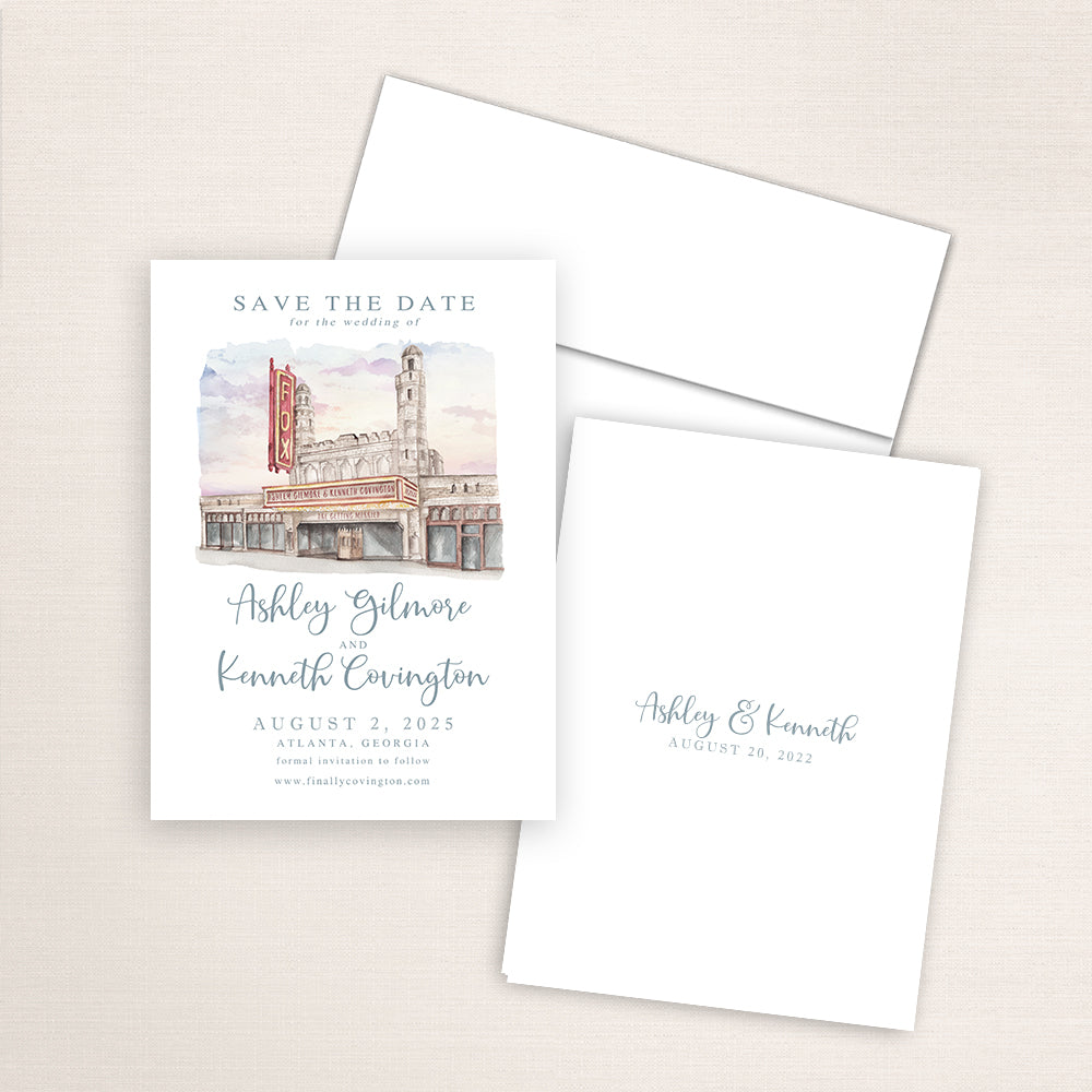 Fox Theatre save the date with detailed watercolor artwork of the Atlanta landmark, refined wedding typography layout, white envelope, and minimalist printed back with couple’s names and wedding date.