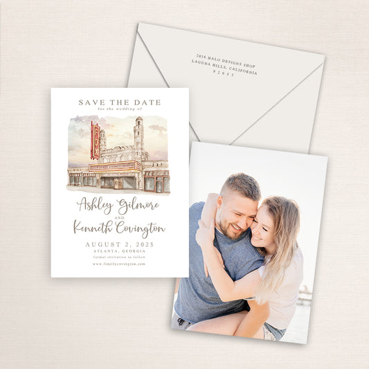 Fox Theatre Atlanta save the date featuring a hand-painted watercolor illustration of the historic marquee and facade, elegant script names, neutral envelope, and engagement photo on the back.