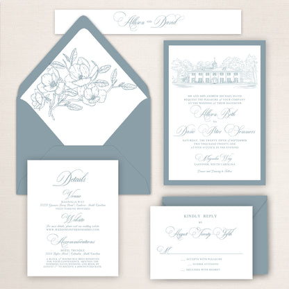 Magnolia Way wedding invitation suite with soft blue envelopes, floral envelope liner, venue illustration, RSVP card, and details insert, designed in a classic calligraphy style.