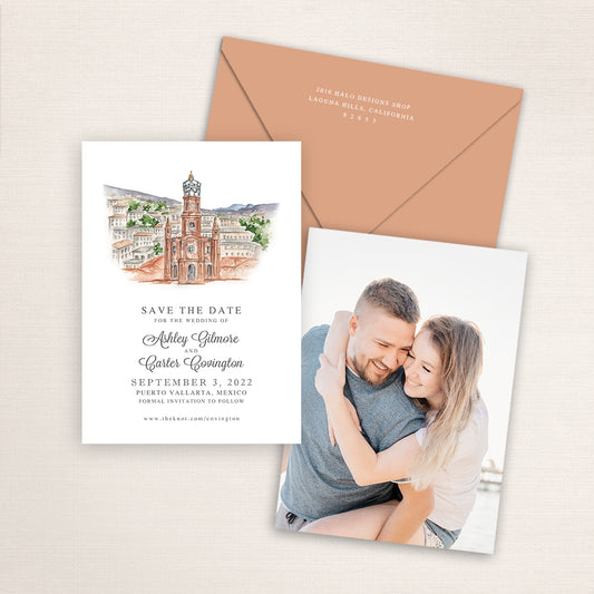 Custom watercolor Save the Date card featuring hand-painted venue illustration of Our Lady of Guadalupe in Puerto Vallarta, Mexico, personalized wedding stationery with elegant venue artwork with matching envelope.