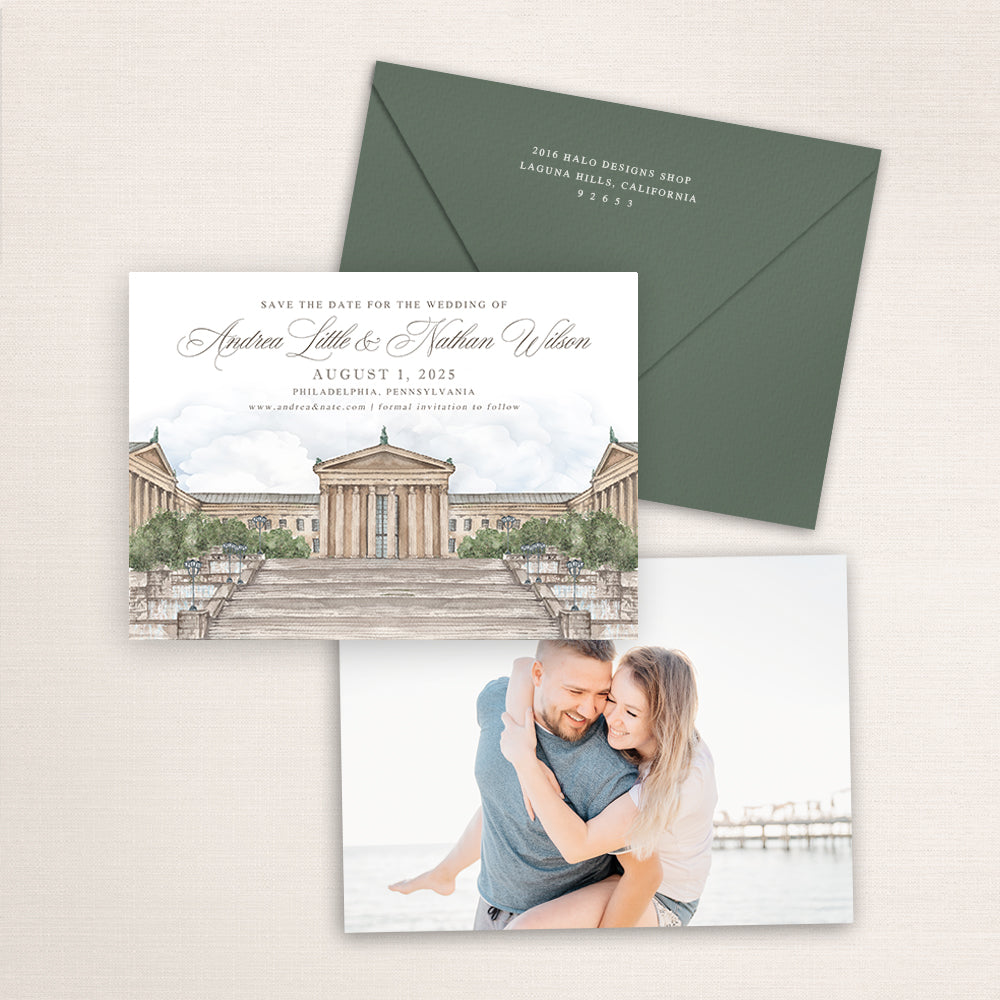 Philadelphia Museum of Art wedding save the date with detailed watercolor illustration of the historic museum and grand steps in Philadelphia, coordinating green envelope, refined calligraphy typography, and engagement photo printed on the back.