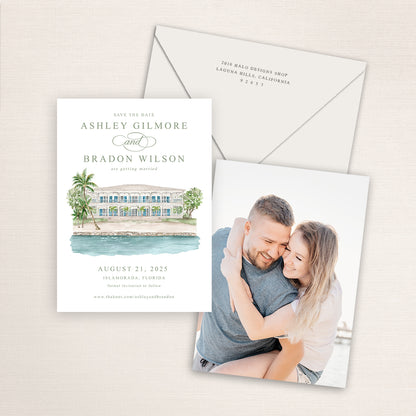 A vertical 5x7 watercolor painting of Pierre's printed on a save the date announcement with a photo on the back and matching envelopes.