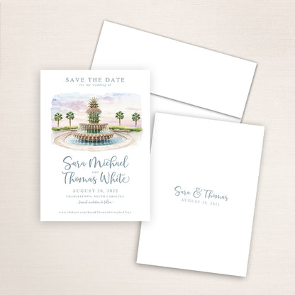 Wedding save the date announcements featuring a watercolor of the Pineapple Fountain in Charleston, South Carolina.